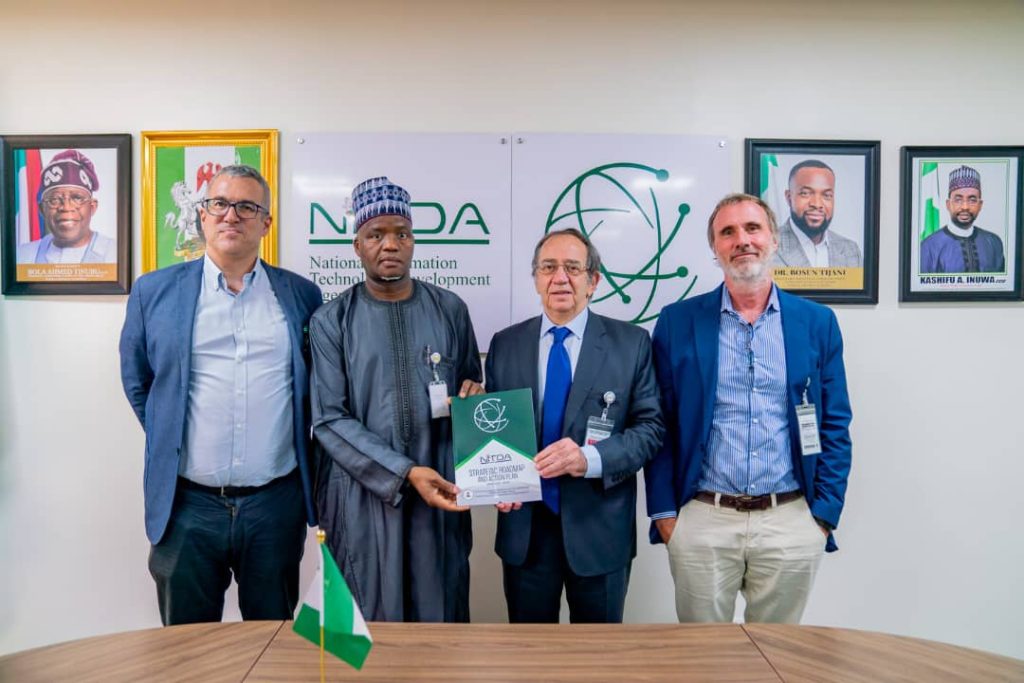 The Ambassador of Spain to Nigeria, Juan Sell, being presented with NITDA SRAP Documents by DG's Representative, Dr Usman Abdullahi Gambo, flanked by Reps of SEIDOR