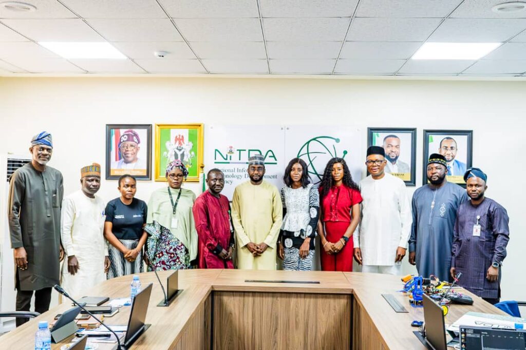 Director General of NITDA Kashifu Inuwa flanked by the Executive Director of Operations and Programmes of Afre.lib Mrs Joice Gomina, members of the NITDA Management team and other representatives of Afre.lib