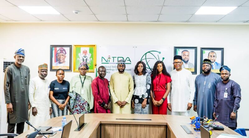 Director General of NITDA Kashifu Inuwa flanked by the Executive Director of Operations and Programmes of Afre.lib Mrs Joice Gomina, members of the NITDA Management team and other representatives of Afre.lib