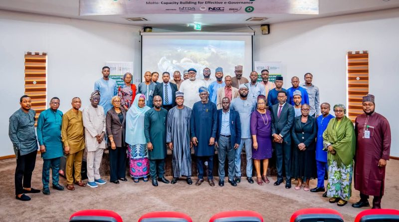 Group photograph of some of the participants with the rep of DG NITDA