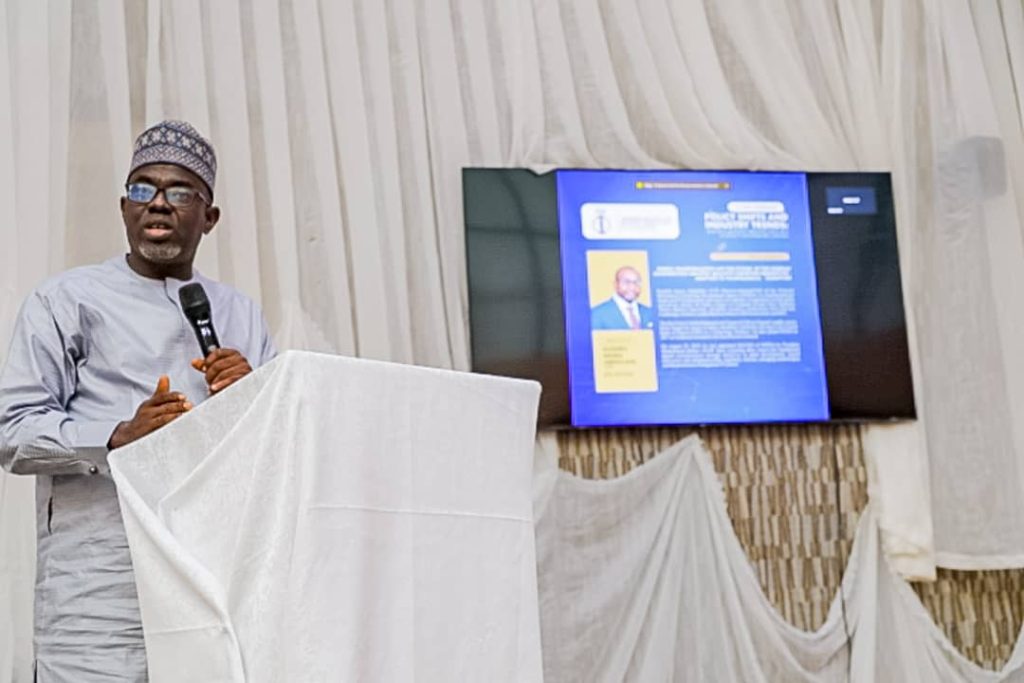 DG NITDA's rep, Dr. Onimisi giving a presentation at the workshop organised by the NIQS FCT Chapter at the National Engineering Centre in Abuja
