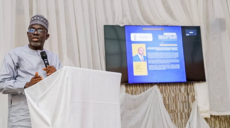 DG NITDA's rep, Dr. Onimisi giving a presentation at the workshop organised by the NIQS FCT Chapter at the National Engineering Centre in Abuja